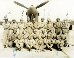 Group PhotoOfficial US Army Air Force Training Command photograph of 20 Tuskegee Airmen posing in front of a plane. Robert Glass is in the middle of the 3rd row. His signature, and that of 10 other colleagues are inscribed on the photograph. 